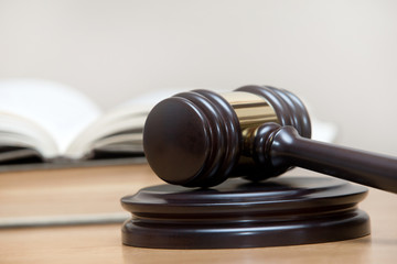 wooden gavel and books