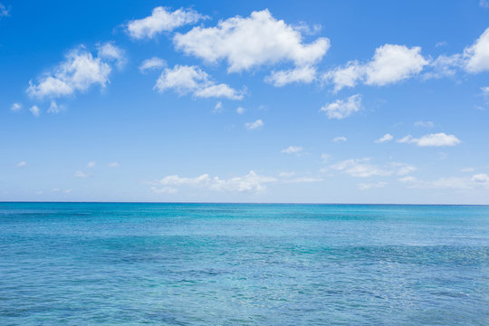 seascape with clouds and blue sky background