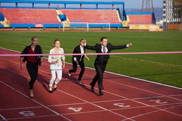 business people running on racing track