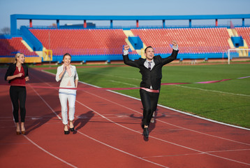 Obraz premium business people running on racing track