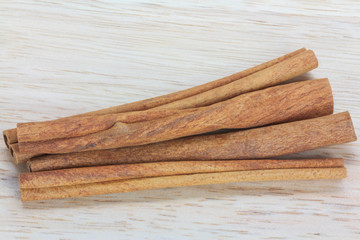 Close up cinnamon stick on wooden background