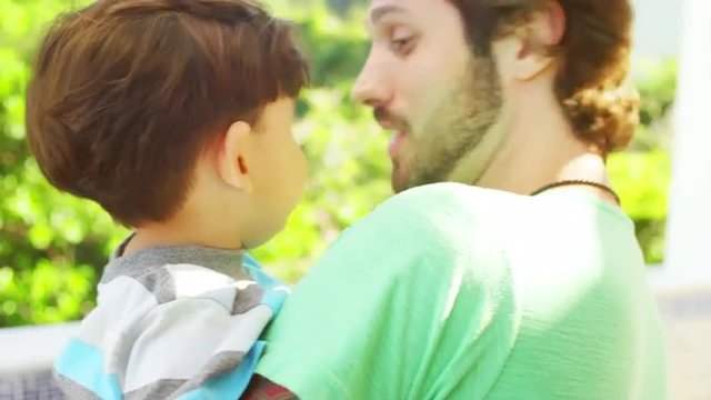 Man with a baby at Brazilian family BBQ
