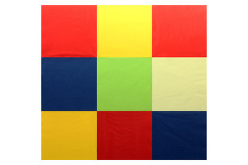 Serving colored paper napkins in the shape of a square isolated 