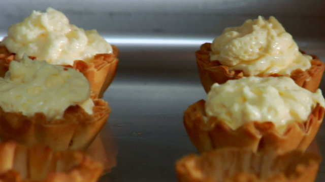 freshly baked dessert cups get a tasty cream filling