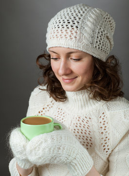 Beautiful Girl Feeling Cold And Holding A Cup Of Hot Drink