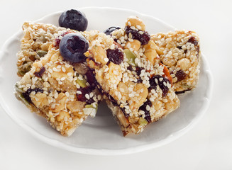 Healthy fruit and nut granola bars on plate