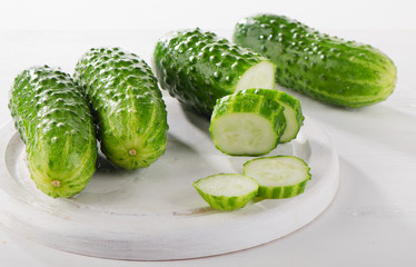 Fresh cucumbers on a cutting board.