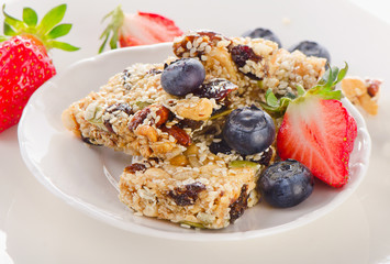 Healthy granola bars on a white plate