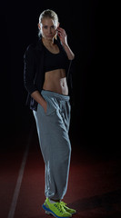 sporty woman on athletic race track