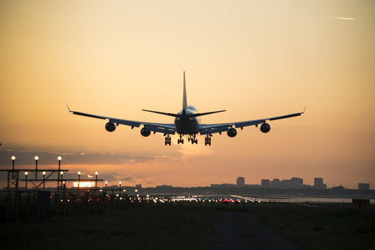 Airplane during landing in the early morning. © New Visuals