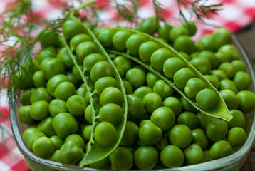 Fresh organic peas in the bowl