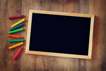 old vintage wooden blackboard on wooden table 