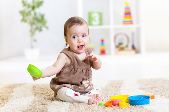 baby playing with toys indoor