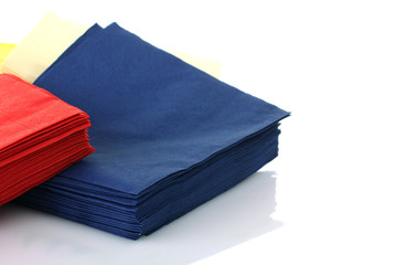 Serving colored paper napkins isolated on white background