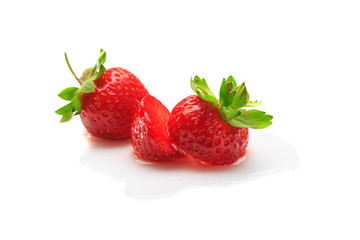 Strawberries in water drops isolated on white background