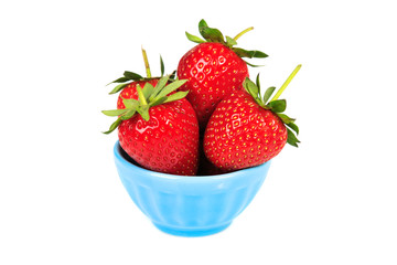 Strawberries in blue cup isolated on white background