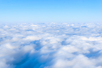 Fototapeta na wymiar skyline view from airplane window. Clouds. Sky and clouds.