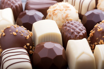Various chocolate pralines as a background
