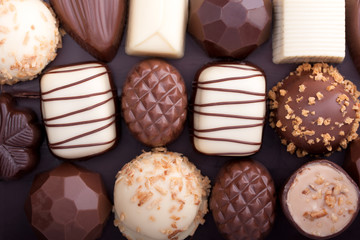 Various chocolate pralines as a background