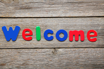 Welcome word made of colorful magnets