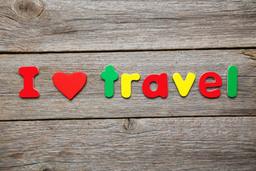 I love travel word made of colorful magnets
