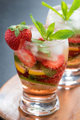 refreshing cocktail with strawberry and citrus, close-up