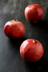 Fototapeta na wymiar Delicious pomegranate fruit on black background