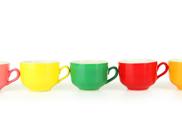 Colorful cups on white background