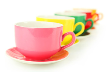 Colorful cups isolated on white