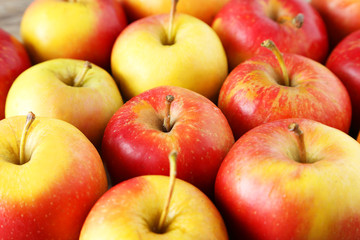 Red apples on grey wooden background