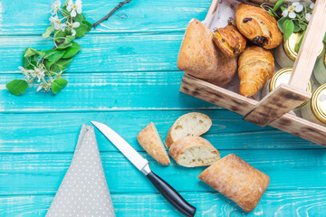 Sliced bread and other baked on a wooden table