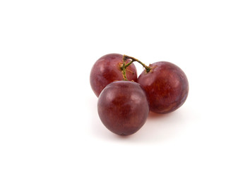 Fototapeta na wymiar Red grape isolated on white