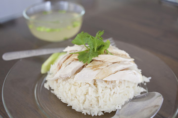 Steam chicken with rice and soup.