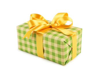 Gift box with golden bow isolated on white