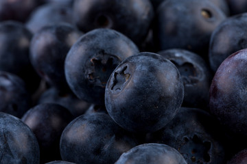 Blueberries on stone plate background