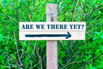 ARE WE THERE YET Directional sign