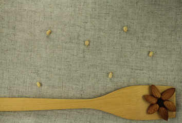 Aabstract view of a wooden shovel with almonds