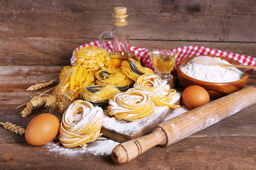 Still life of preparing pasta on rustic wooden background