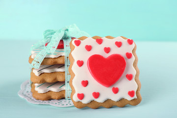 Obraz na płótnie Canvas Heart shaped cookies for valentines day on color wooden background