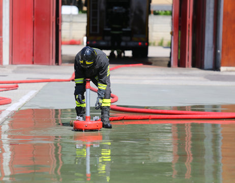 Firefighter positions a powerful fire hydrant during the exercis