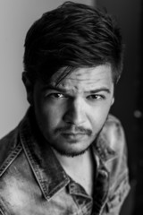 Black and white portrait of a handsome macho or badboy