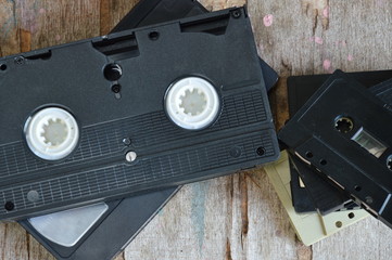 video tape and cassette tape on wood board