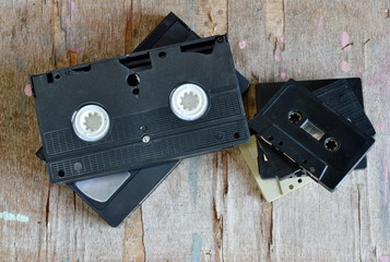 video tape and cassette tape on wood board