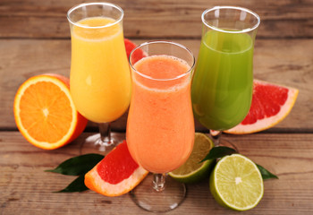 Fresh summer cocktails with fruits on wooden background