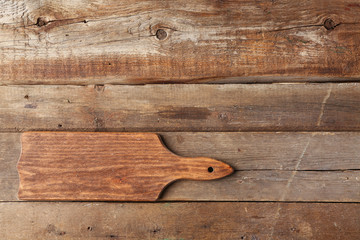 Fototapeta na wymiar Cutting board on wooden background