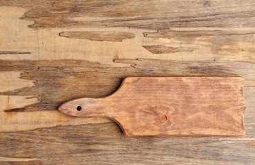 Cutting board on wooden background
