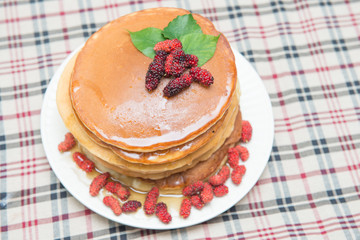 Delicious pancakes with fresh mulberry and honey