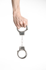 Prison and convicted topic: man hands with handcuffs isolated