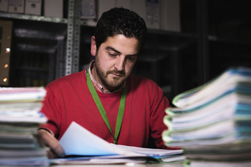 Office clerk at files basement