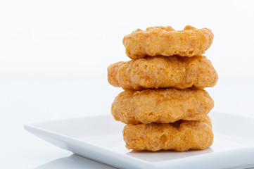 Group of fried chicken nuggets on white dish